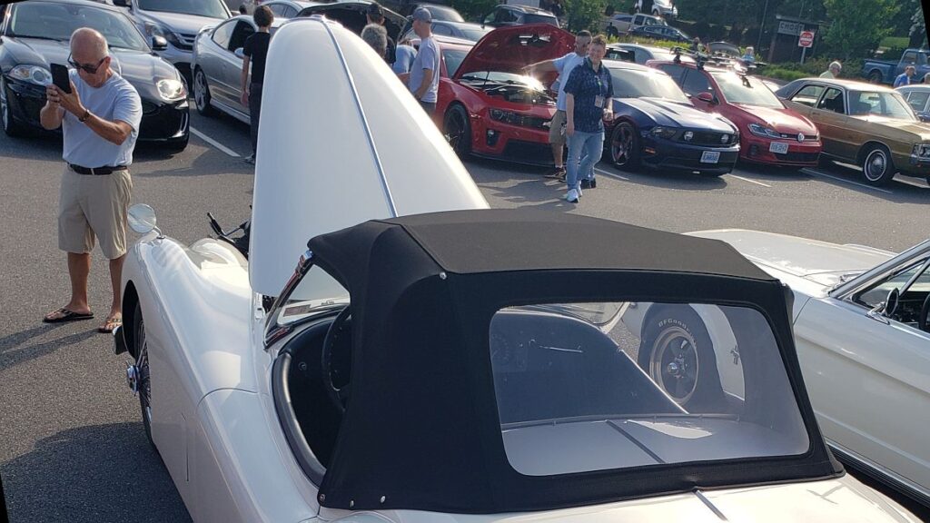 A vintage 1950s Jaguar XK140 OTS (roadster) at Cars & Coffee, Charlottesville, VA in 2026.